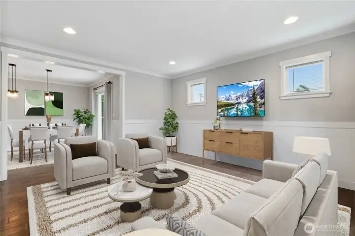 An elegant dining room setting where people enjoy conversation in the living room as well. An elegant dining room setting where people enjoy conversation in the living room as well.