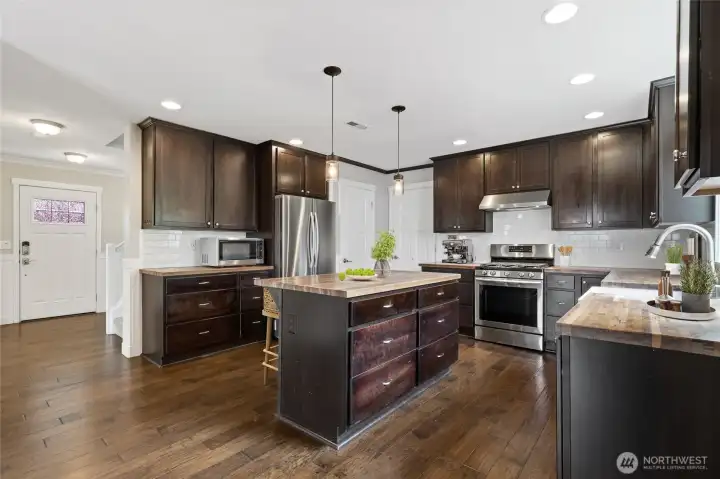 Chef's kitchen featuring favorite butcher block countertops all around, and a new extra-large sink installed in June 2026 Chef's kitchen featuring favorite butcher block countertops all around, and a new extra-large sink installed in June 2026