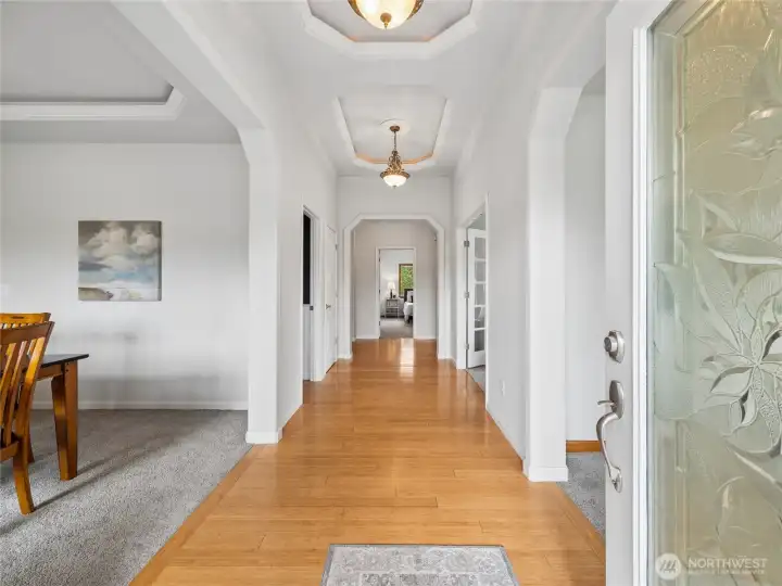 A grand entry experience highlighted by architectural ceilings and beautiful bamboo flooring. A grand entry experience highlighted by architectural ceilings and beautiful bamboo flooring.