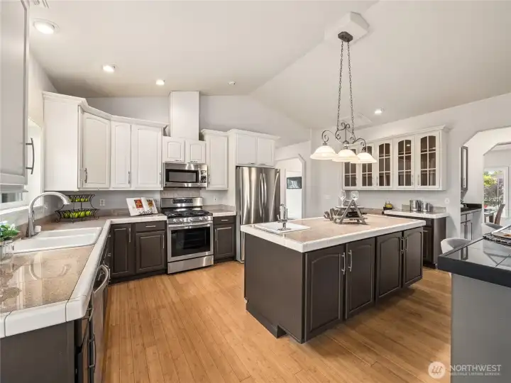 Bright and open gourmet kitchen crafted for gathering, cooking, and entertaining with ease. Bright and open gourmet kitchen crafted for gathering, cooking, and entertaining with ease.