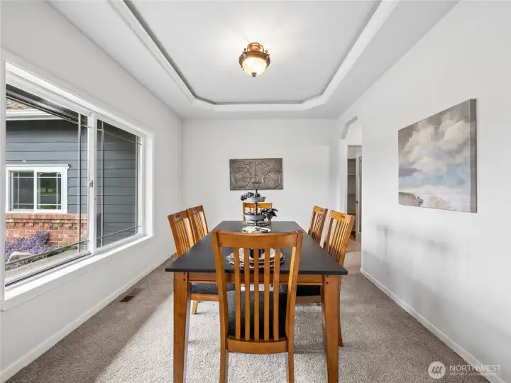 Refined dining space with an elegant coffered ceiling and a large window that opens the room to the soothing sounds of the nearby cascading water feature. Refined dining space with an elegant coffered ceiling and a large window that opens the room to the soothing sounds of the nearby cascading water feature.