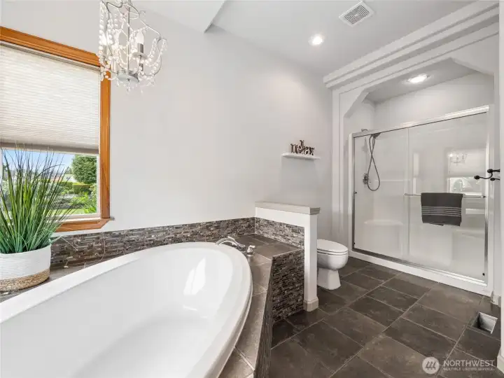 Thoughtfully designed primary ensuite featuring both the soaking tub and a separate shower option for personalized comfort. Thoughtfully designed primary ensuite featuring both the soaking tub and a separate shower option for personalized comfort.