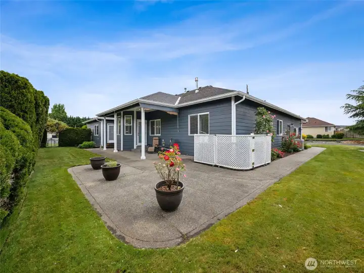 Beautiful outdoor living space with partially covered patio and serene golf course vistas. Beautiful outdoor living space with partially covered patio and serene golf course vistas.