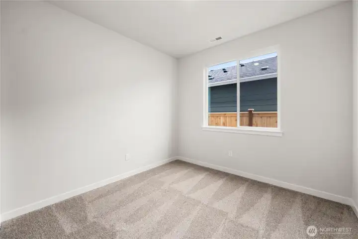 Bed 2. Photos of a previously completed home. Actual colors and finishes may vary. See site agent for details.