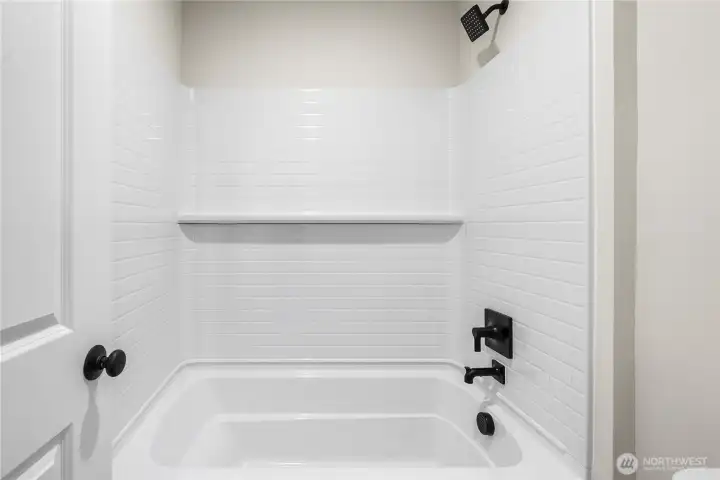 Upstairs bath/shower.Photos of a previously completed home. Actual colors and finishes may vary. See site agent for details.