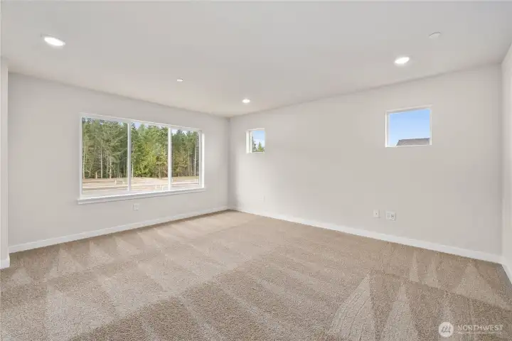 Primary Bedroom. Photos of a previously completed home. Actual colors and finishes may vary. See site agent for details.