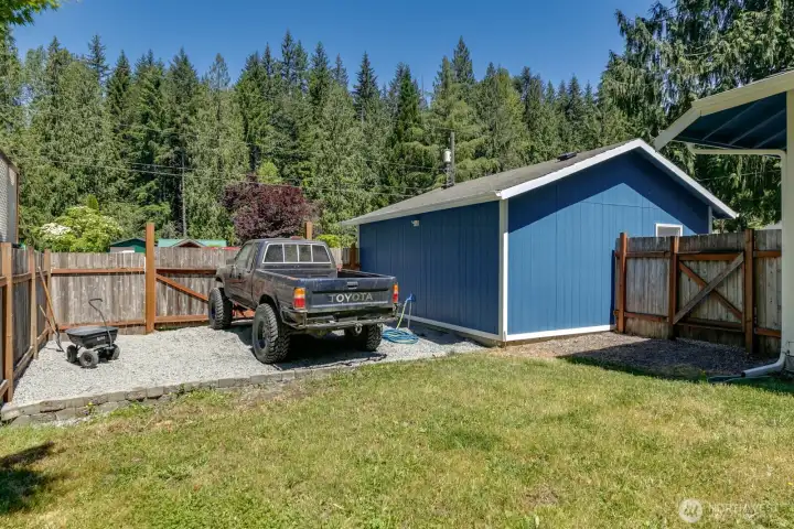 Even more parking through the sideyard fence, behind the garage in the backyard.