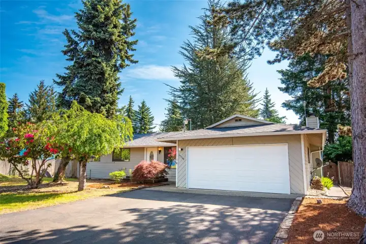A brand new roof and mature landscaping give a welcome feeling upon arrival!