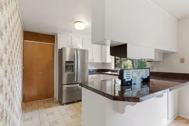 The kitchen offers plenty of cabinet space!