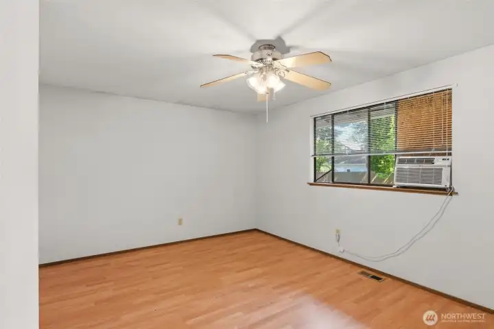The primary bedroom includes a ceiling fan.