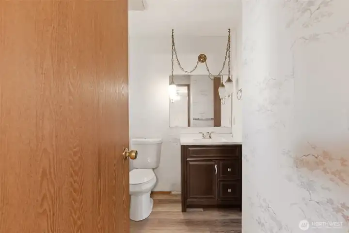The main bathroom can be accessed off of the living room or the primary bedroom.
