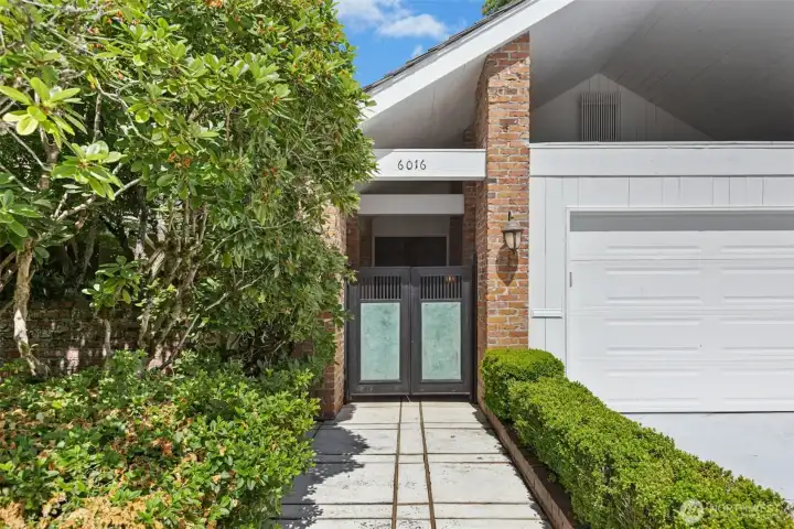 A beautiful gated courtyard allows for privacy and a covered, welcoming Entrance.