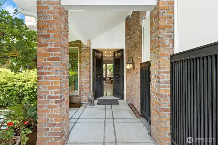 Mid-Century covered entry welcomes you in through the private courtyard.