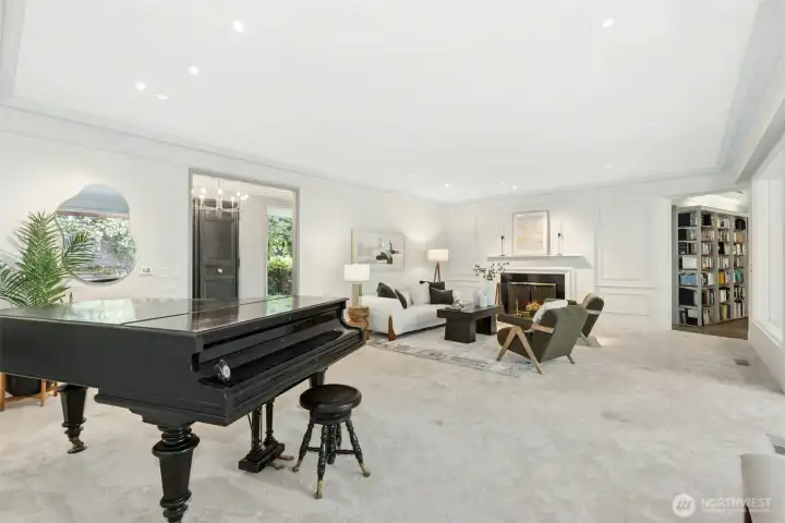 This entertainment sized living room offers room for a Baby Grand Piano (negotiable).  Entry through doorway on left and Library / Den through door on right.