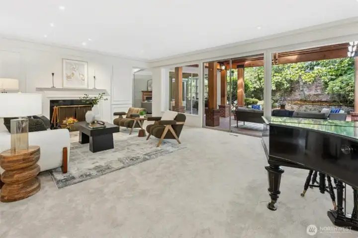 Oversized windows and sliding doors lead to covered back patio.