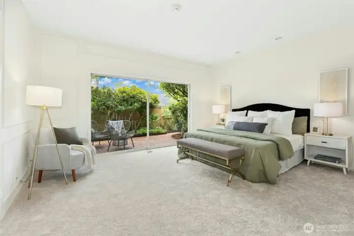 Oversized Primary Bedroom on the main floor with slider to private patio