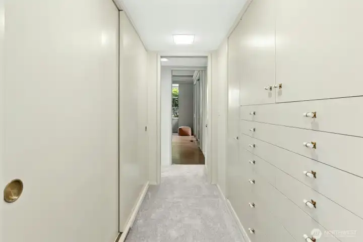 Walk through closet ara of Primary Bedroom. Look at all of the built-in drawers & cabinets in addition to the closet space!  Organization at it's finest!