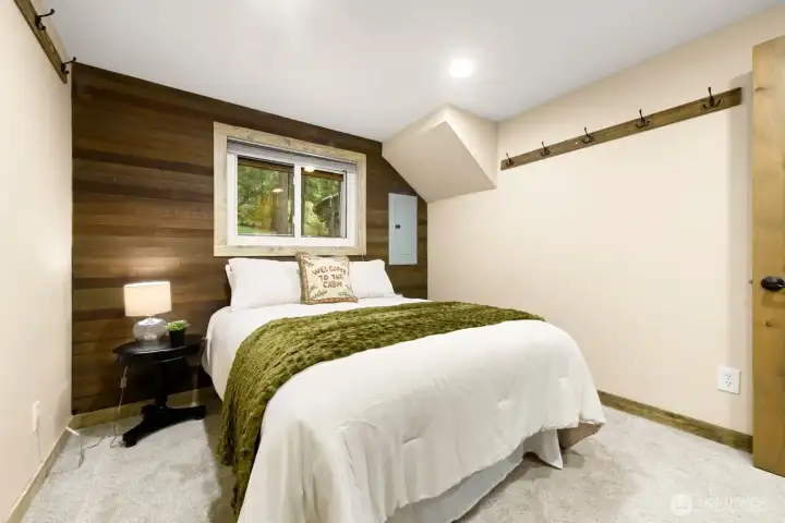 A comfortable main-floor bedroom offers convenience and flexibility for owners and guests alike. A comfortable main-floor bedroom offers convenience and flexibility for owners and guests alike.