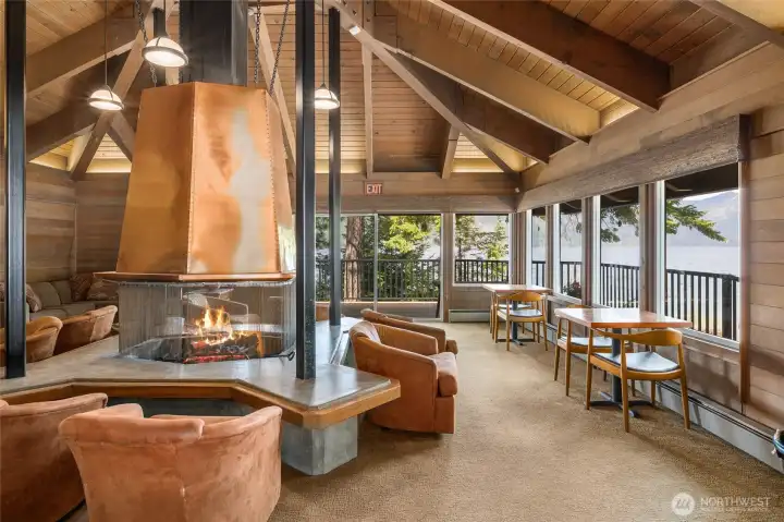 Relax beside the impressive stone fireplace while taking in panoramic views of Lake Cle Elum. Relax beside the impressive stone fireplace while taking in panoramic views of Lake Cle Elum.