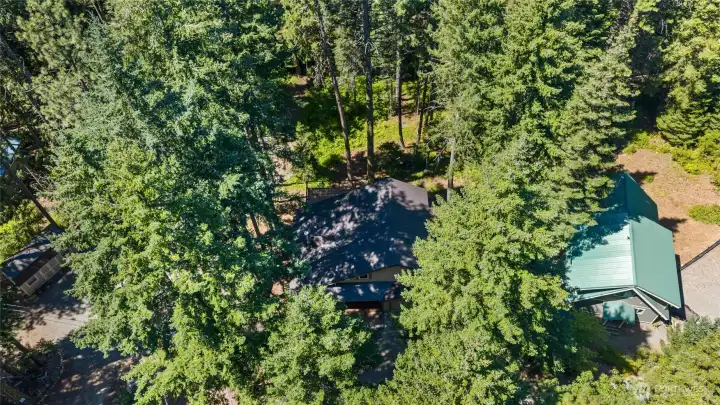 Nestled among towering evergreens, this mountain retreat offers the privacy and peaceful setting that make weekends at the lake feel a world away. Nestled among towering evergreens, this mountain retreat offers the privacy and peaceful setting that make weekends at the lake feel a world away.