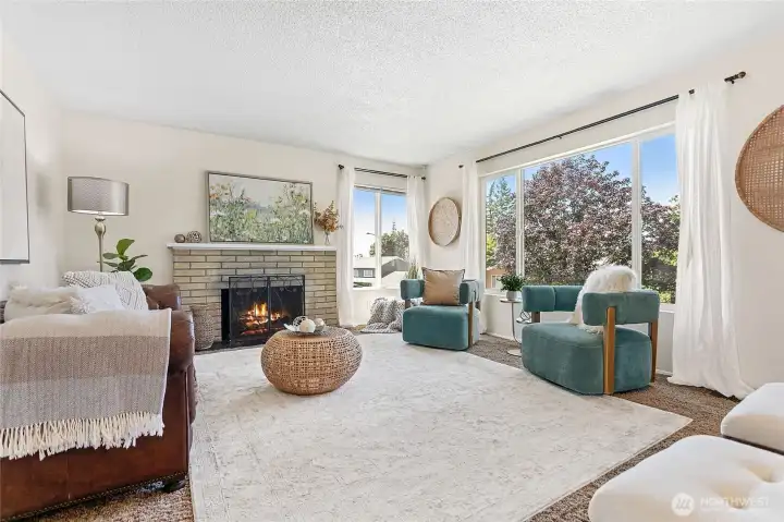Large upstairs living room with wood fireplace and peak a boo view of the bay Large upstairs living room with wood fireplace and peak a boo view of the bay