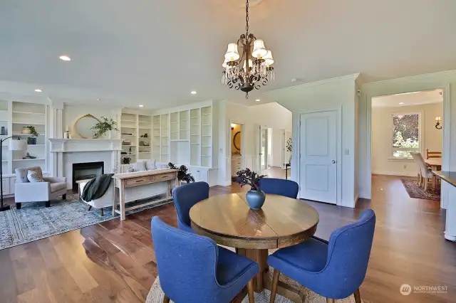 Another perspective, bringing in the living room with the custom shelves. 3/4 bath is through the open door to the right of the bookshelves.