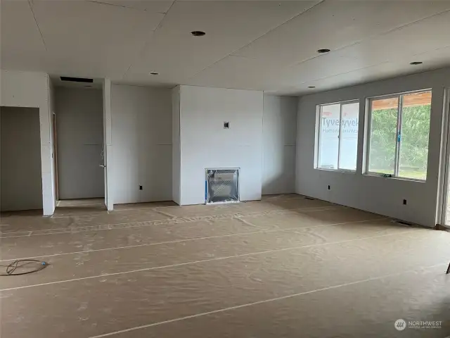 Looking from the kitchen into the great room and out onto the 8 x 21 covered patio