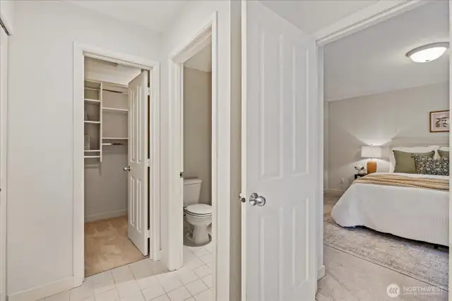 Primary suite includes a walk-in closet with closet system.