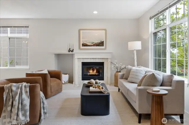 Cozy fireplace with elegant tiling adds ambiance and warmth.