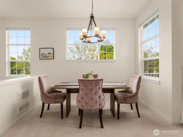 Dining area next to balcony and living room