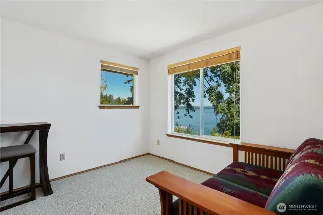 Upstairs bedroom #1, has lots of natural light with amazing water & mountain views as well.