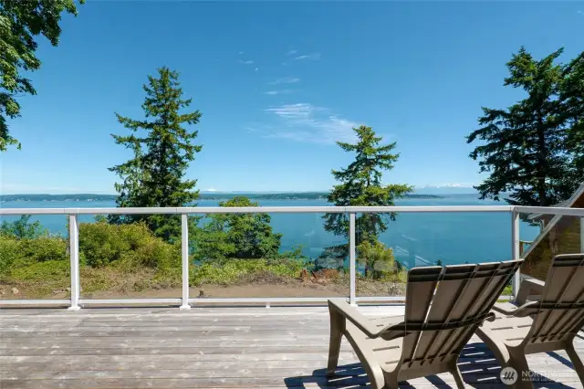 Large 10' x 28' deck with glass railings has gorgeous water views & mountain views of snow capped Mt Baker & the Cascades. Also wonderful for entertaining, whale watching or relaxing.
