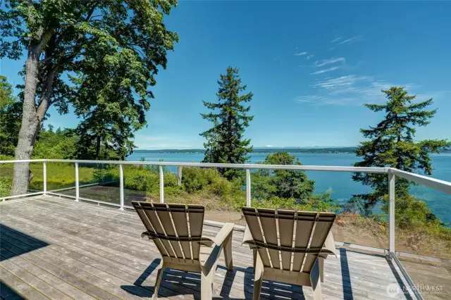 Large 10' x 28' deck with glass railings has gorgeous water views & mountain views of snow capped Mt Baker & the Cascades. Also wonderful for entertaining, whale watching or relaxing.