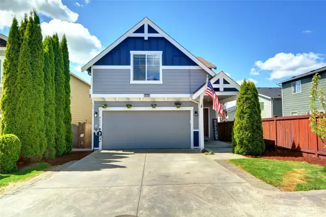 Private driveway and welcoming front of the home