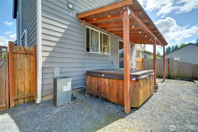 Covered hot tub to relax in your fully fenced, low maintenance back yard.