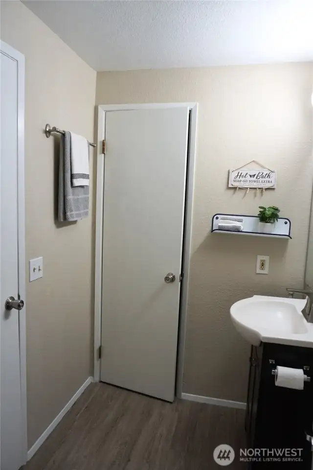 Gain access to the bathroom from the main hallway or the bedroom