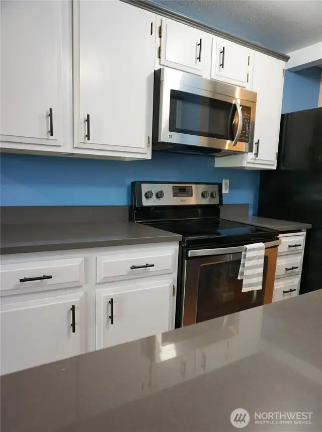 Light and bright renovated kitchen with Quartz countertops