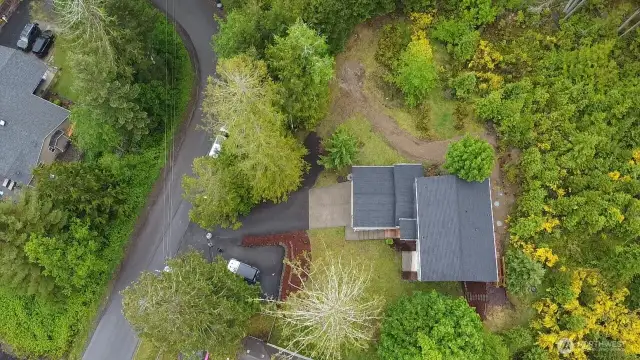 Overhead of home with second lot above the home in photo