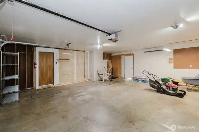 Large 2 Car Garage-Interior Door to Kitchen. Exterior Door to backyard