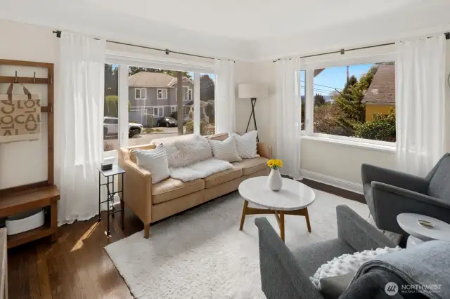 As you enter the home you walk into the living room with several large windows.
