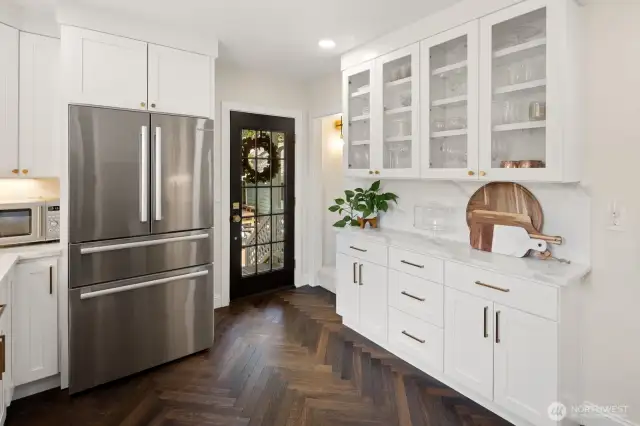 The built-in China cabinet is a great feature that maximizes the storage space in this kitchen!