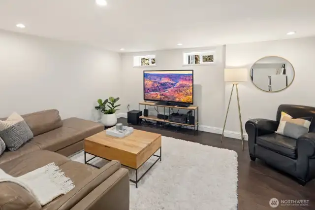 Downstairs there is spacious rec/tv room.