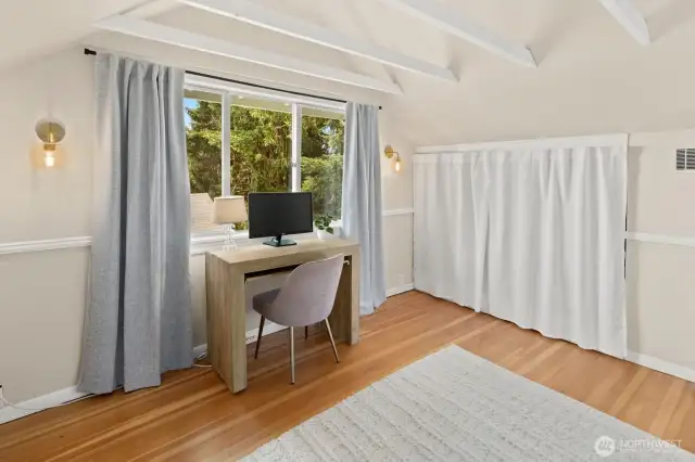 The built-in twin bed space on this side of the room is being used as a 3rd closet in this room.