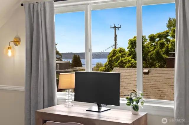 There are partial views of the sound out this window in the west upstairs bedroom, you can see the ferry crossing to Vashon.