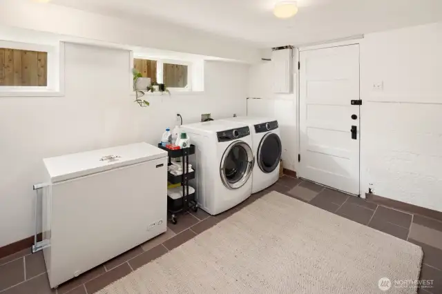 This is the laundry room on the lower level, there is space for shelving along the wall on the right (not pictured).