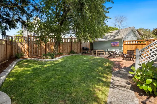 The backyard is fully fenced, with 2 gates - one to the driveway and another to the front yard.