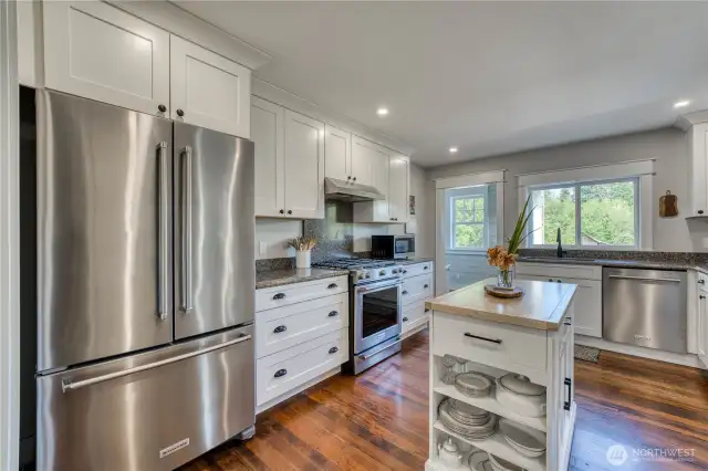 All the appliances are new and the door on the left goes to a mud room.