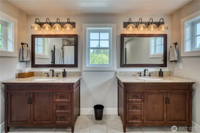 The primary bath with separate double vanities. The windows have nice pasture views.