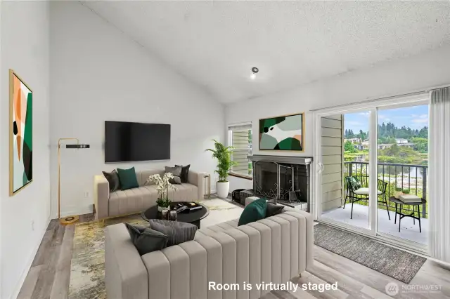 Bright living room with cathedral ceilings & view of the Lake