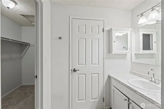 Primary bath with peak into WIC